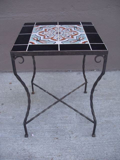 Gladding McBean Tile Top Table with Wrought Iron: Beautiful Gladding McBean tile top table with light turquoise, brown, and white: All surrounded by black tiles. All items ship from Early California Antiques in Los Angeles, CA. All items are authenti