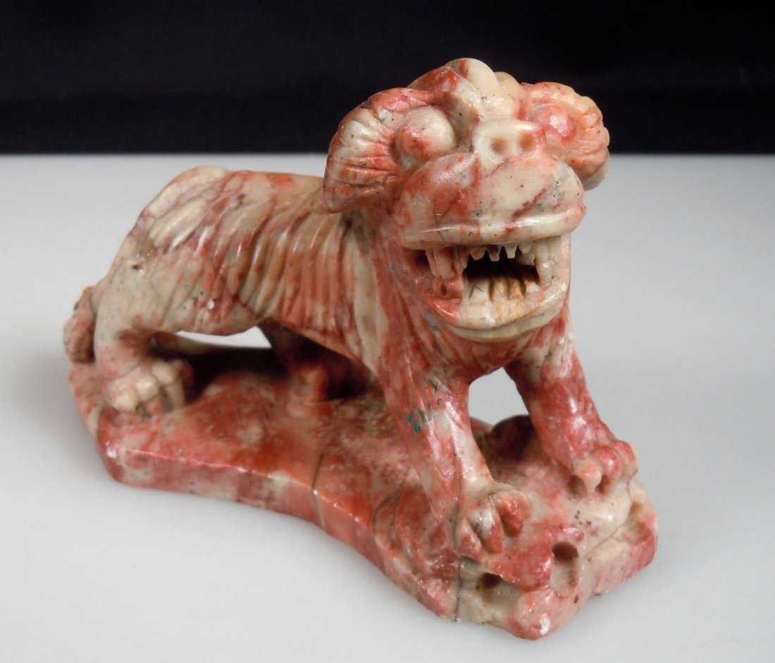 Chinese Carved Soapstone Sculpture RED LION: Chinese Carved Soapstone Sculpture of a red and white lion. It measures 4.75" in length and stands 3 1/8" in height. A few scuff marks. No repairs. No Reserve Free shipping for this item within the co