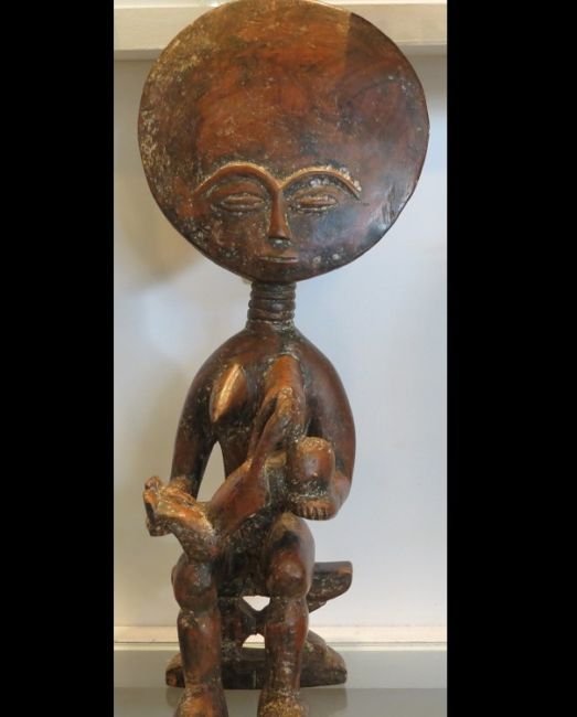 Unusual Antique African Ghana Tribal Fertility Doll: Unusual Antique Ghana Tribal Fertility Doll Sculpture IN EXCELLENT CONDITION!!! This wonderful uniquity is a genuine antique and dates to the 1800's. It is a very unusual example featuring a nursing b