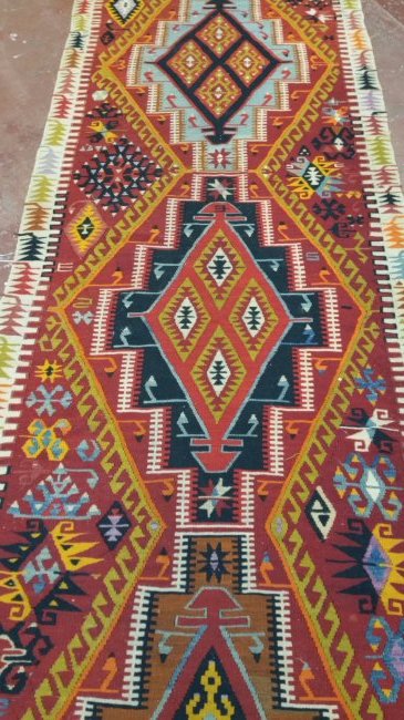 Turkish Antique Kelim Runner: circa 1920sKilims are produced by tightly interweaving the warp and weft strands of the weave to produce a flat surface with no pile Size: 3.7 x 13.5 No Reserve