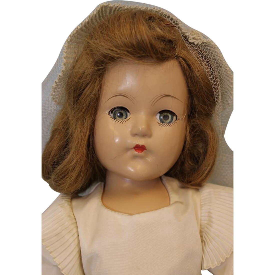 Early 19" Effanbee Composition Bride Doll All Original: This beautiful Effanbee bride is in her original wedding dress and carries her original bouquet and her veil is delicately placed on her head. She has green sleep eyes with all of their lashes. Her fa