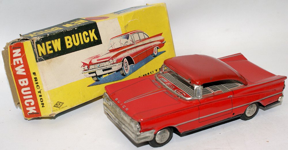 Vintage Tin Friction Red NEW BUICK Toy Car in Original: Vintage Tin Friction Red NEW BUICK Toy Car by GK, Japan. Friction works well! A few small paint chips on the roof. Excellent condition in the original box. Car measures 6-3/4" long. Buyer pays for shi