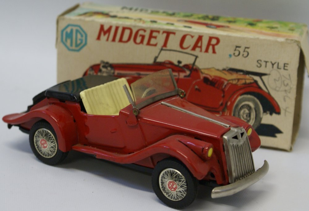 SSS Japan Red 1955 Style Friction Tin Plate Litho MG: SSS Japan Red 1955 Style Friction Tin Plate Litho MG Midget Car. Gorgeous little car. Mint in the original box. Box is missing one end flap. Measures 6-1/2" long. Buyer pays for shipping. This item sh