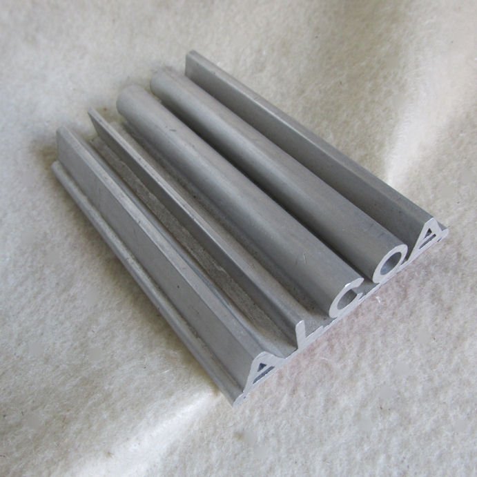 Vintage Alcoa Advertising Pen Tray, Desk Pen Holder: A vintage advertising desk top pen holder. The pen holder is made of aluminum and spells out "ALCOA". It has an advertising label on the bottom. Overall dimensions are 4" x 2 3/4" x 3/8". No Reserve
