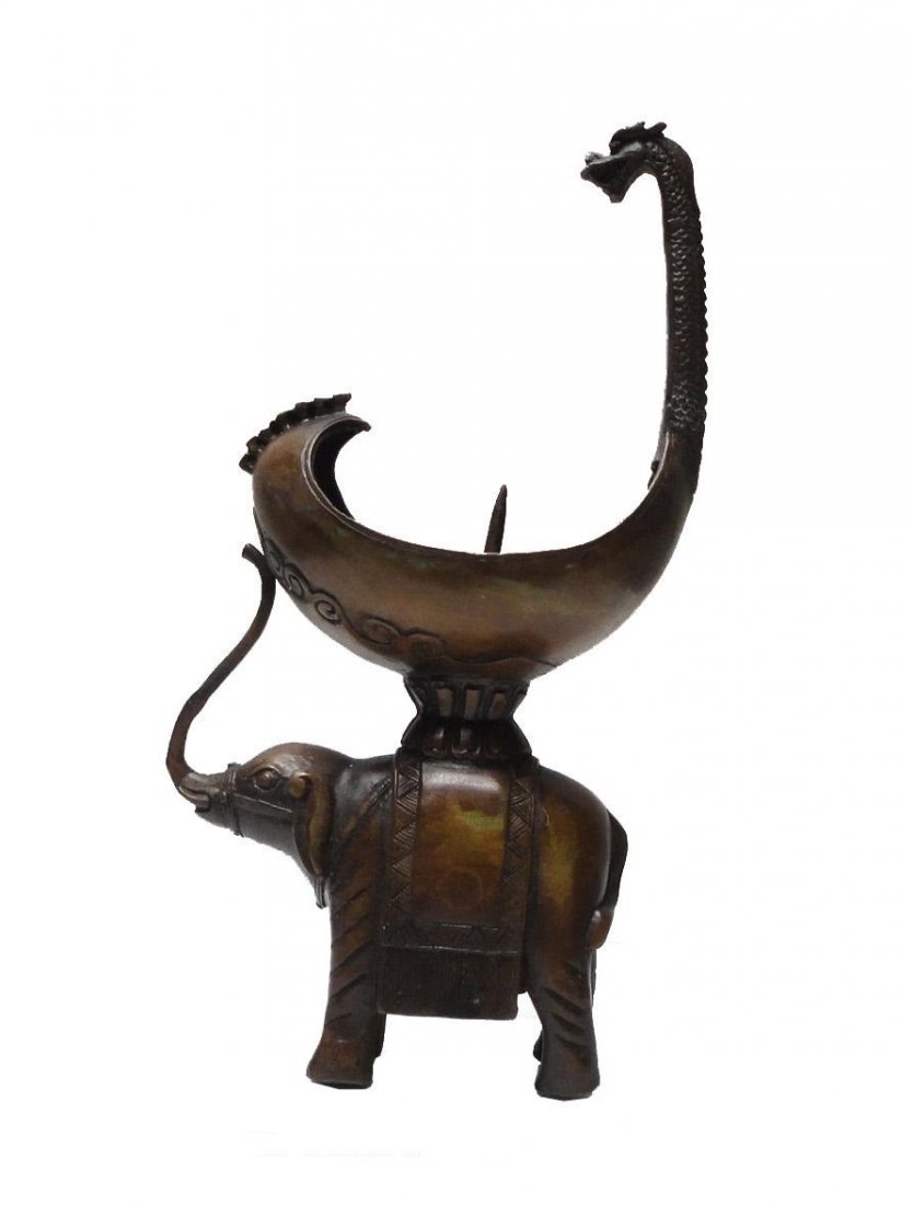 Chinese Bronze Artistic Elephant Candle Holder Figure: Dimensions: w5" x d2.75" x h9.75" Origin: China Material: Bronze Metal Condition: Reproduction, hand made, rustic finish. No Reserve Buyer pays shipping. This item ships from San Mateo, CA