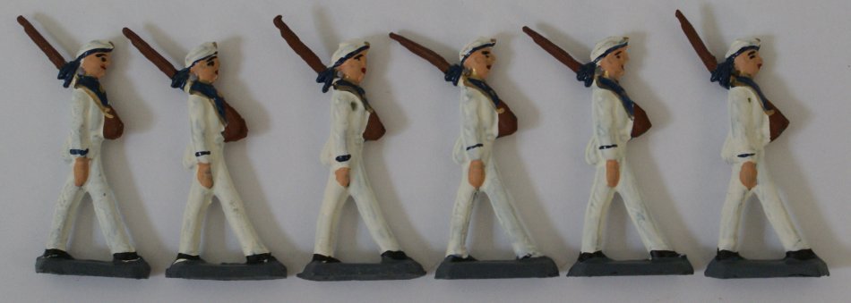 Lot of 6 US Navy Military Lead Hand Painted Toy: Lot of 6 World War I US Navy Military Lead Hand Painted Toy Infantry WWI Soldiers. Total of 6 cast marching sailor figures holding rifles. Figures measure a total of 2-1/2" tall from top of rifle to b