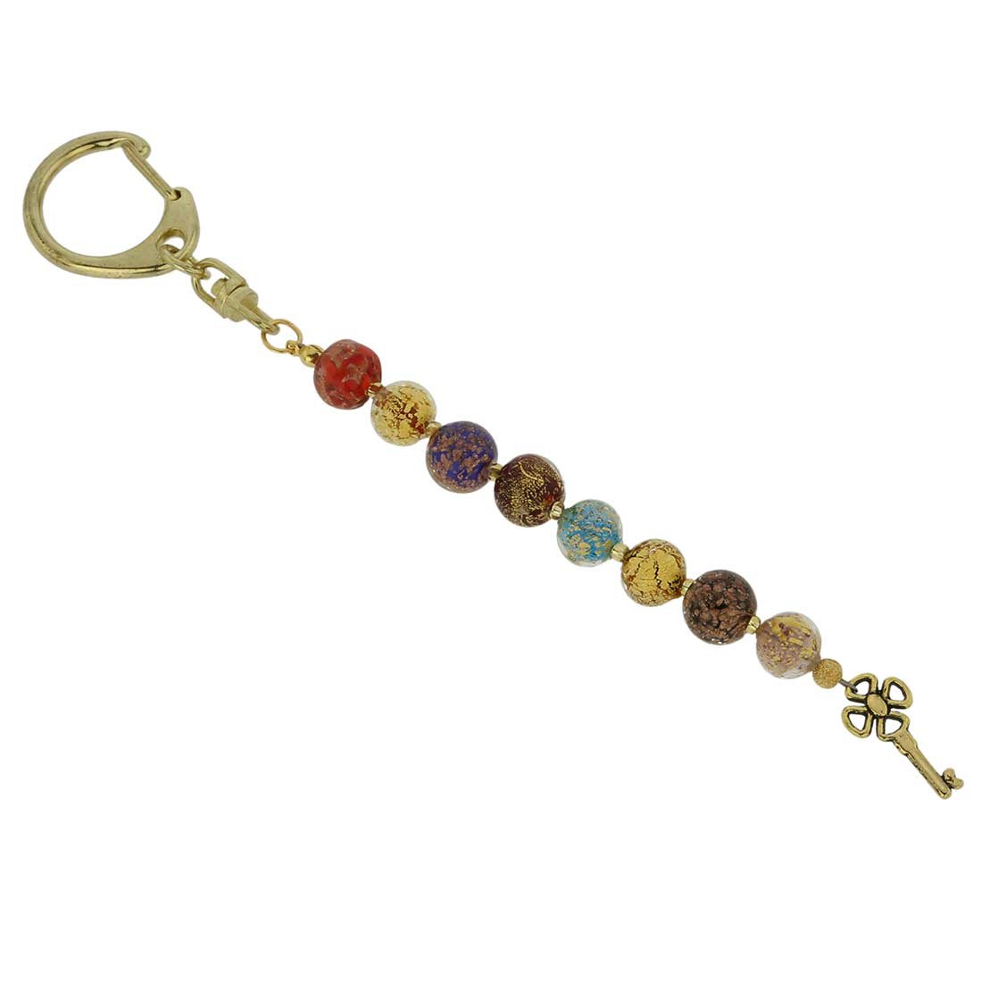 Feast of Colors Murano Keychain: A statement of elegance and style, our unique artistic Murano Glass Keychain shimmers and shines with the wonderful colors of Venice. Featuring a string of beautiful Venetian beads handcrafted using a