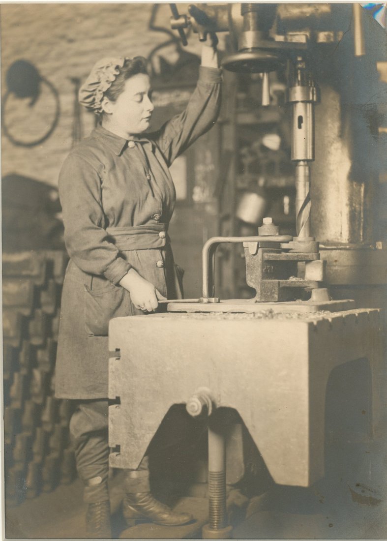 Woman operating large drill press WW1 (1 of 1)