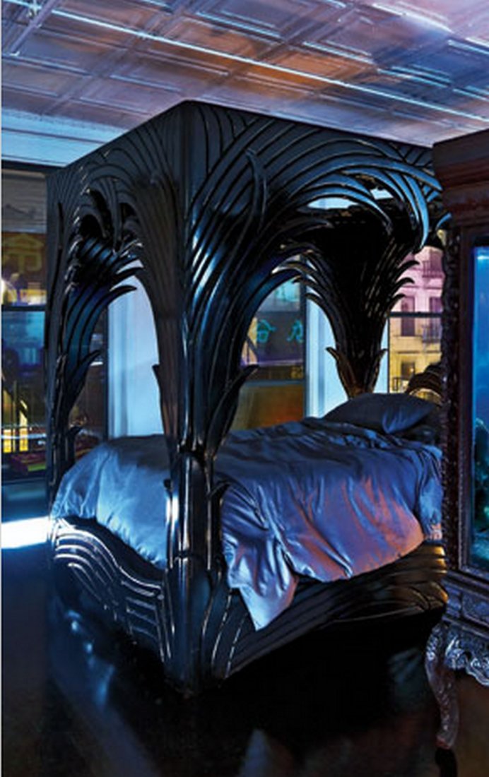 An Amazing and Ornately Carved Queen Sized Canopy Bed: An Amazing and Ornately Carved Queen Sized Canopy Bed by Phyllis Morris with built in down-lighting. C. 1980s. This an extremely rare and well crafted bed. Down-lighting is above the headboard and the