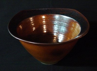 Paul Jeselskis: This deep, gold squared top bowl features a beautiful gold glaze. 11-1/4" diam x 5-3/4" h. Signed on the bottom. Paul Jeselskis: "My glaze technique is based upon layering one glaze over another to cr