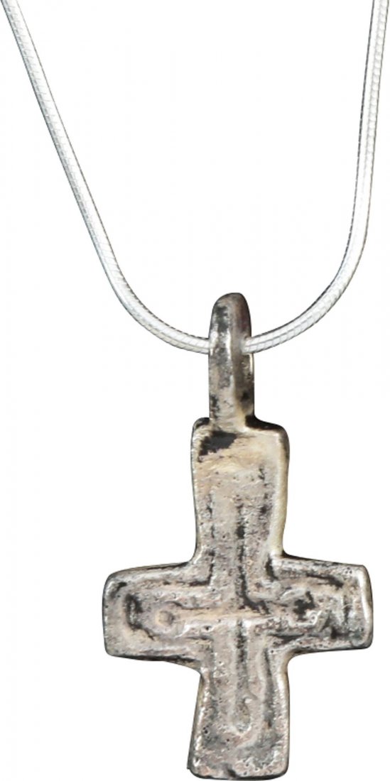 BYZANTINE PILGRIM'S CROSS: 5th-8th century. Bronze, 1 3/16" height. Originally plated and now resilvered for modern wear on a sterling silver chain. Nearly symmetrical with incised line cross within. The surface with light text
