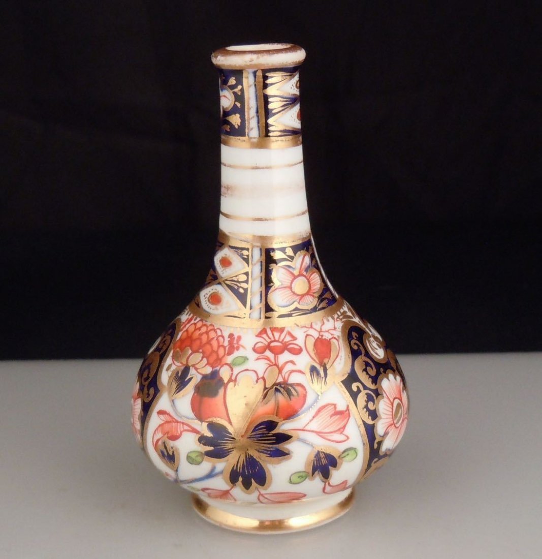 Antique 1820s Royal Crown Derby Imari Mini Vase 3.5": Antique small vase from Royal Crown Derby with marks used between 1806-1825. It stands 3.5" in height, some gilt rub to the neck and top rim. No Reserve Free shipping for this item within the continen