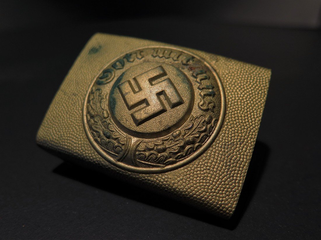 WWII German Nazi Buckle: This Lot Includes a Rare Gold Toned German Nazi Polizei "Police" NCO / Enlisted Man's buckle. It is a rectangular shape and is made of molded aluminum. The pebbling throughout the surfaces is still st