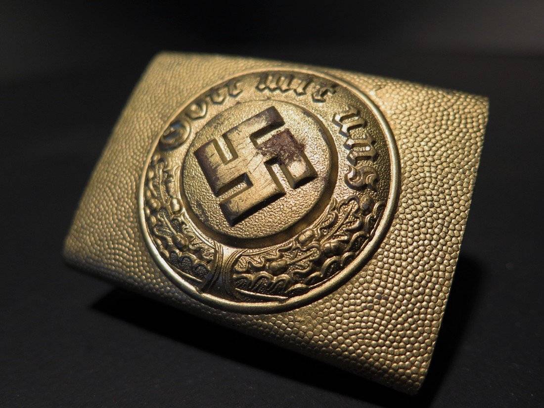 WWII German Nazi Buckle: This Lot Includes a Rare Gold Toned German Nazi Polizei "Police" NCO / Enlisted Man's buckle. It is a rectangular shape and is made of molded aluminum. The pebbling throughout the surfaces is still st