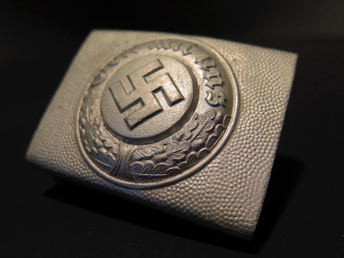 WWII German Nazi Buckle: This Lot Includes a Rare Aluminum German Nazi Polizei "Police" Enlisted Man's buckle. It is a rectangular shape and is made of molded aluminum. The pebbling throughout the surfaces is still still seen