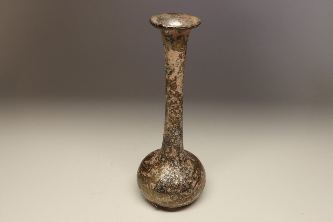Ancient Roman Glass Bottle: Medium: Glass Provenance: Formerly Aegean Antiquities, GA Presently, Private Collection, New York, N.Y. Detailed Description: A great example of a blown glass bottle of yellow-green color. The bottle 