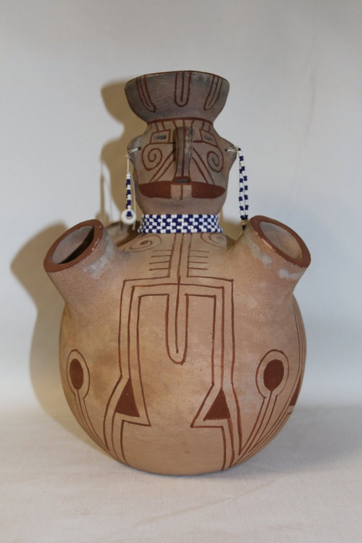 Native American Art : Outstanding Mojave Pottery: Native American Art 1970's 80's red on buff 4 spout face design signed Elmer Gates 9.75"x6"x6". Elmer Gates, was born in 1929 and lived in Poston, Arizona on the Fort Mojave Reservation. He had learne