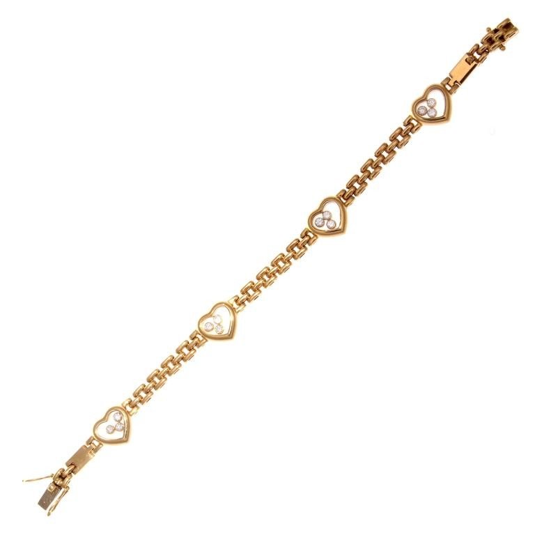 Chopard Happy Diamond Gold Heart Bracelet: A love filled creation from the happy collection at Chopard. Designed with transparent hearts filled with joy from 3 lively white, clean diamonds in each motif. Crafted in glistening 18k yellow gold.