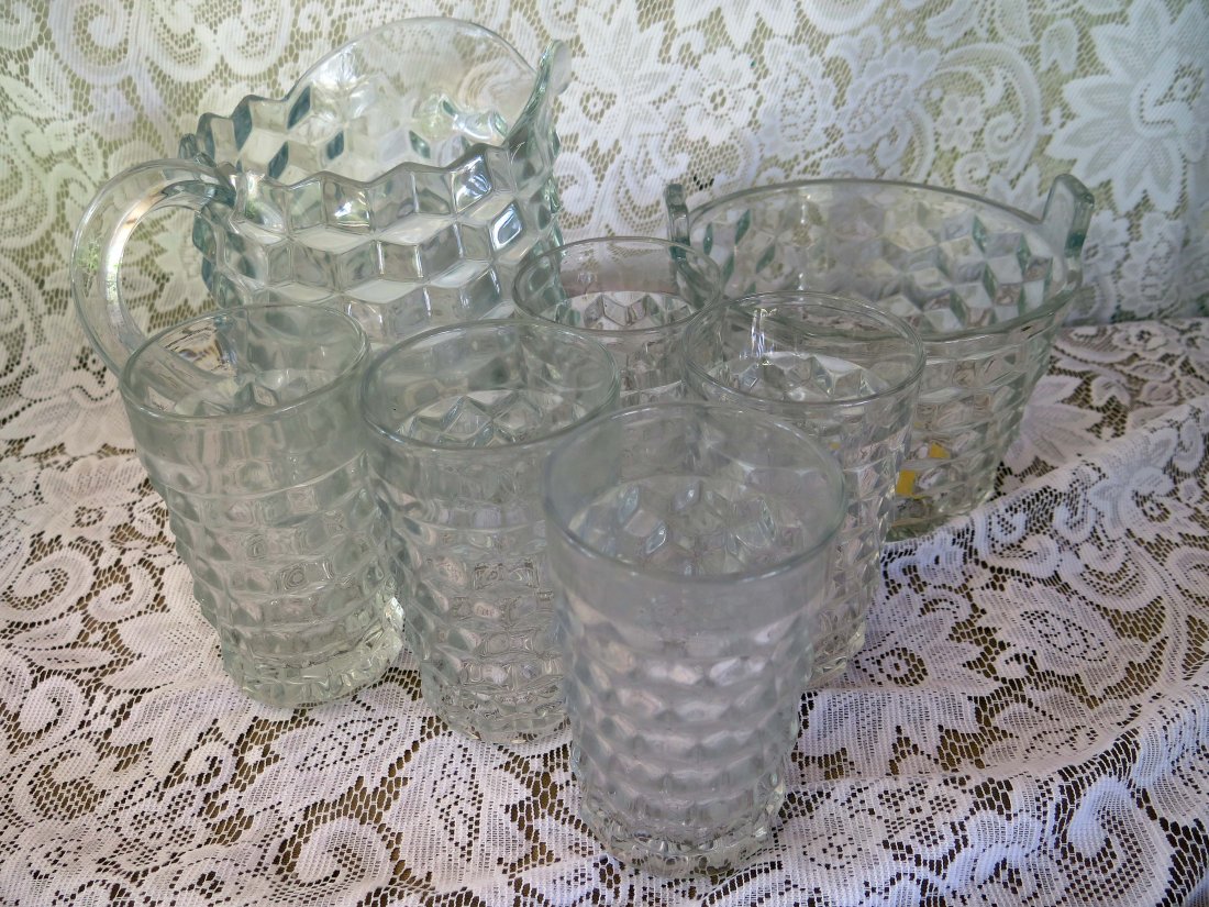 Fostoria American Pitcher and Cups: This lot includes a Fostoria American Flared Lip Water Pitcher with 5 Cups and (1) Tabbed Ice Bucket. The Pitcher measures 7 1/2" Tall. No Reserve Buyer pays $28 flat rate domestic shipping per item. 