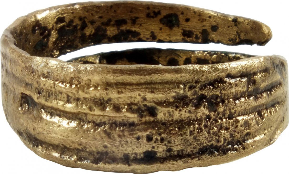 Viking Broad Bezel Ring: About 900 A.D. Variation of the iconic shield rings. Large size 11 1/2. The bezel of five ridges (reeded) tapering from the middle and blending to the overlapping prong band. Surface with evidence of