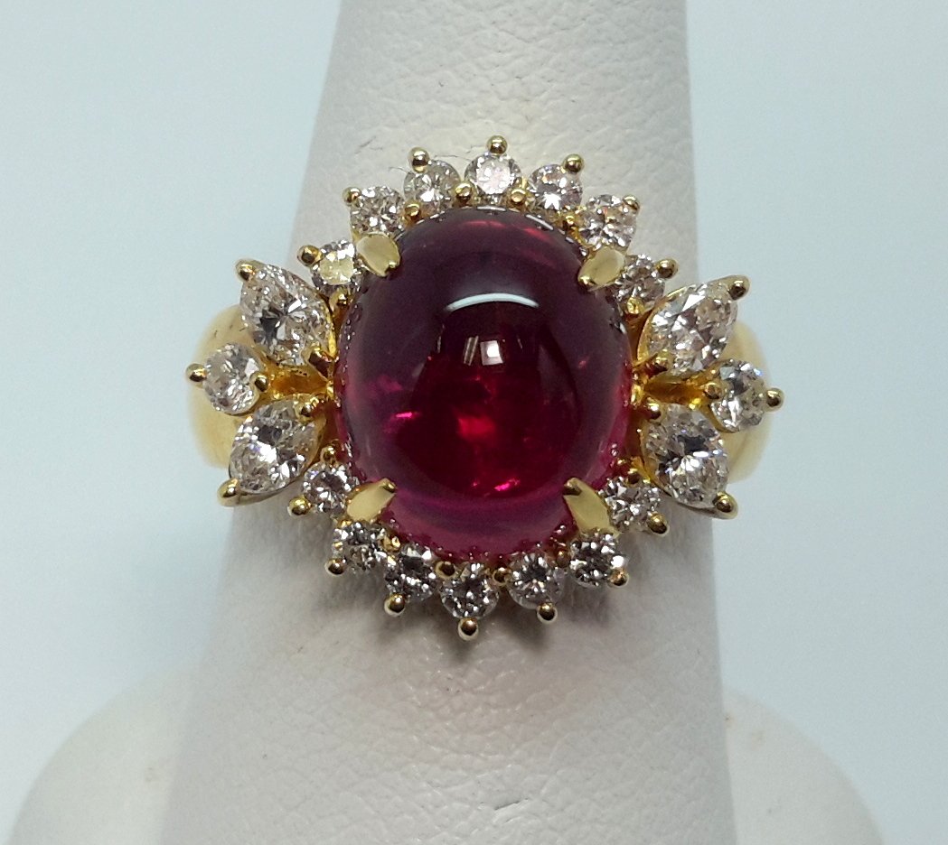 18K Yellow Gold Diamond Rubellite Ring: 18K Yellow Gold Diamond Rubellite Ring. This elegant ring has a big 8.00 ct. rubellite natural stone which is framed by 1.45ct round and marquise white diamonds. Crafted in 18k yellow gold. Shipping D