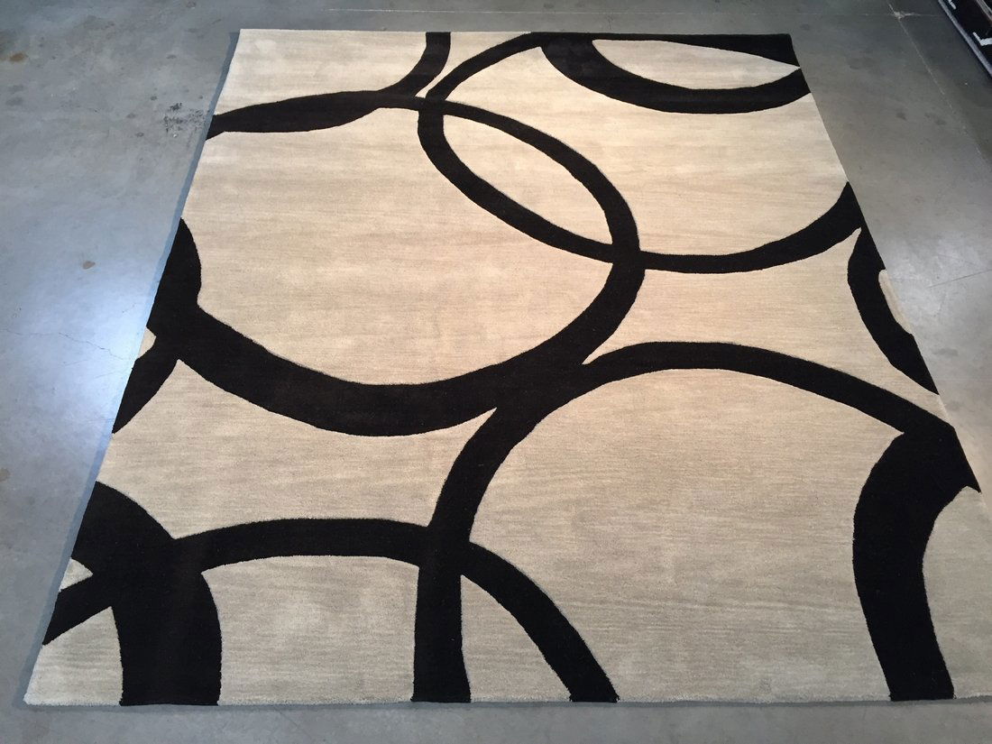 8X9 Modern Design Wool Hand-Made Rug: 7'.6"X9'.0" Hand-made and hand carved modern circle design rug in white and black colors; easy to clean and care. Made of 100% hand spun wool pile, hand made in India. Shipping Domestic: Free shipping