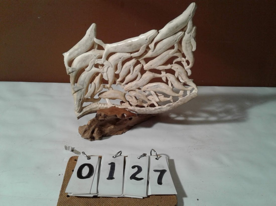 Estate Carved Whale Sculpture: Beautifully done estate whale sculpture of 20 whales carved out of moose antler sitting on a piece of driftwood 10 1/2"W x 10 1/2"H