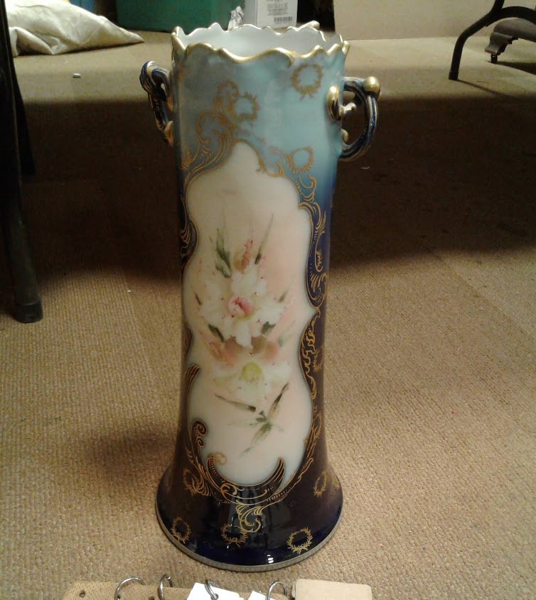 Pairpoint/Limoges #2016/84 Victorian Porcelain Vase: Pairpoint/Limoges #2016/84 Victorian hand painted 1890 porcelain vase of a child holding a basket of flowers(nicely done)-chip to base the rest is in mint condition 15"H x 6 1/2"Base