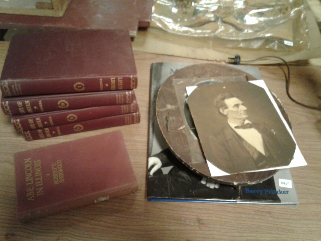 Oval Period Frame with Real Photo of Abraham Lincoln: Real photo of Abraham Lincoln with no beard in a suit & bow tie in a oval period frame along with a Mathew Brady book of Lincoln + other Civil War books.(we do not know of this is a Brady photo? By Ba