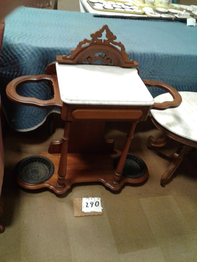 1890 Victorian Walnut Marble Top Hall Stand W/Holders: Clayton Estate - 1890 Victorian walnut marble top hall stand with umbrella holders + Iron removeable cups at base. This was a hall tree & has been adapted for the Doctor's home. It has 1 drawer. 37"H 