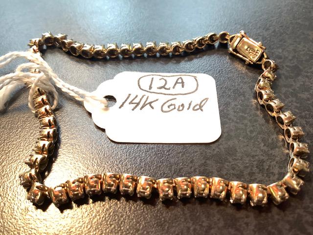 Diamond Tennis Bracelet: Estate diamond tennis bracelet with 57 diamonds. Total weight of approximately 1.2 carats. Signed IL O. 7.2 dwt (10.9 grams)
