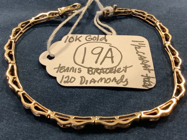 10K Gold Diamond Tennis Bracelet: 10K gold diamond tennis bracelet with 120 square cut diamonds. Approximate total weight of 1.5 carats. 7.5" long. 4.4 dwt (6.8 grams)
