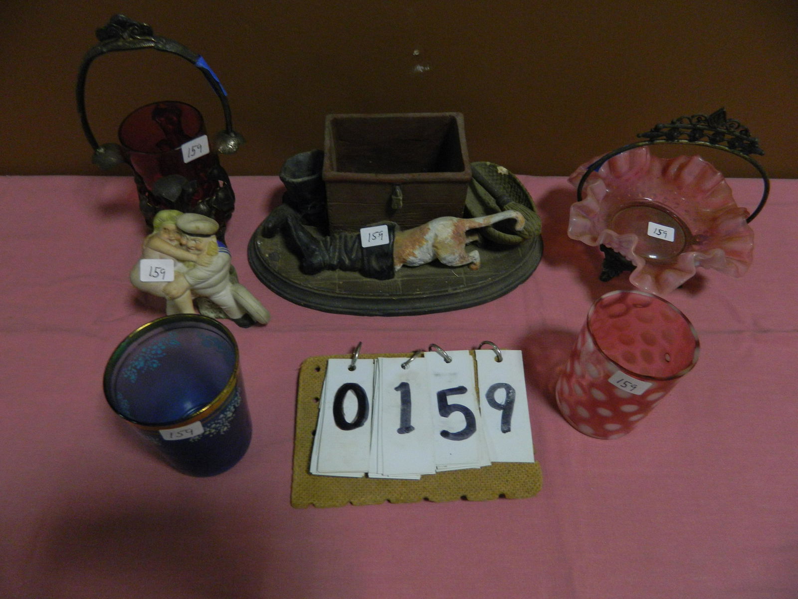 6 Antique Items for 1 Money: 1 ceramic whimsical 1860s tooth pick holder. Dog stuck in boot. Small chip on the basket. 10.5"l x 6.5"w. 1 Sailor 19th century Bisque erotic figurine. Made in Germany. 3.75"h x 4"w. 1 Fenton bridal b