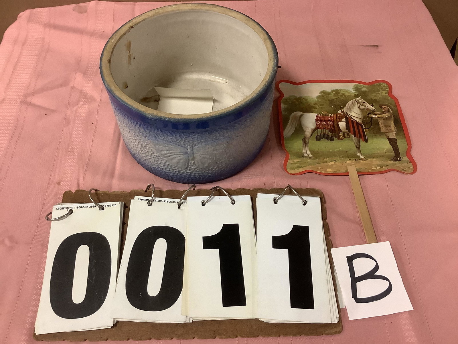 1890s Butter Crock and Buffalo Bill Fan: 1 early 1900s Buffalo Bill Cody and Horse paper and wood handled fan. With advertising on the back - reads "Fred J. Klipple Cedarville, NY Dry Goods". 1 1860s American butter blue crock with metal bai