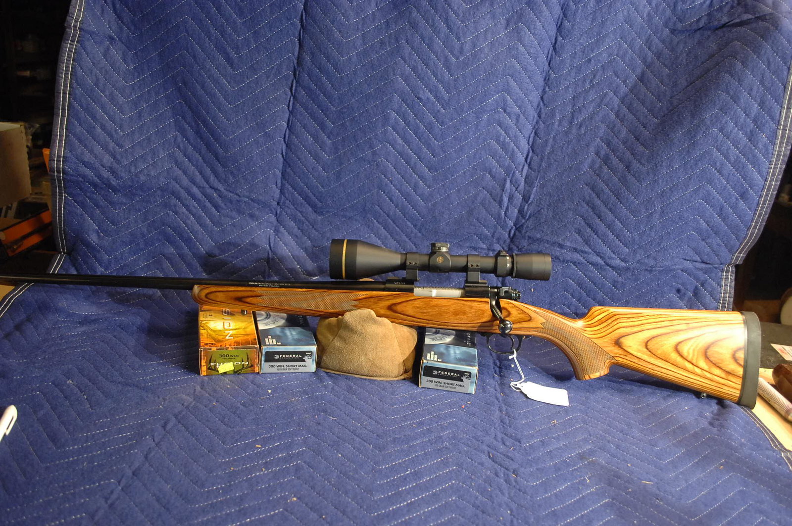 Winchester Model 70 LH rifle: "Winchester model 70, custom LH Model 70, re-worked trigger, jeweled bold and perfect custom wood stock"..30 WSM, Leupold VX-3I, ammo inc. Left handed.