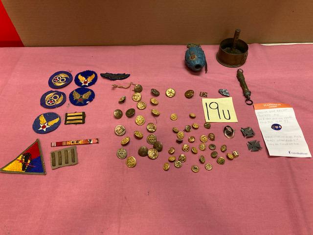 Miscellaneous WWII Items: (2) German metal crosses. (1) Brass American artillery shell ashtray. (1) Hand grenade (not live). (10) Patches. (50) Eagle brass buttons (small and large). (2) Rings (one is Normde).