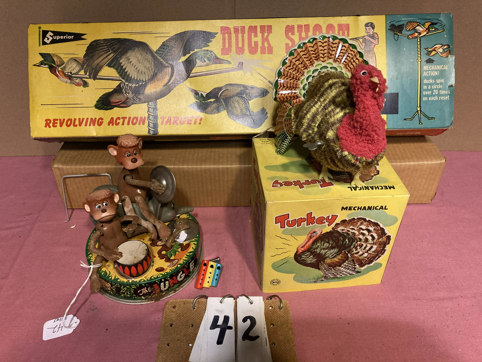 Lot of 3 Toys: Superior Duck Shoot #225 by T. Cohn, Inc. 1950s Brooklyn, NY. Mint in the box game. Cap gun is manufactured by Daisy. No caps found for gun. The box is torn on the ends and there are minor scratches t