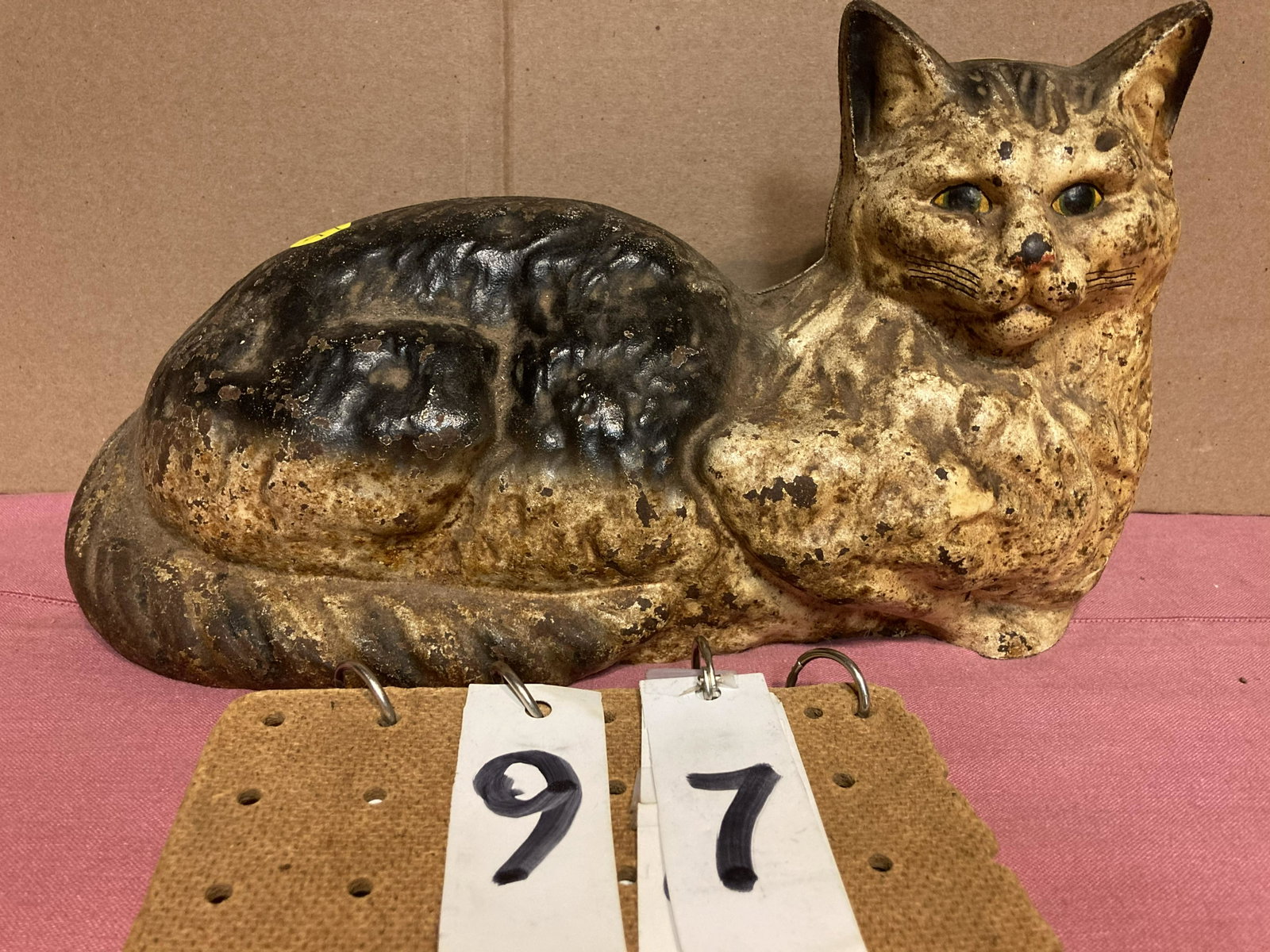 Cast Iron Door Stop: Old cast iron door stop of a cat laying down in original paint. Minor paint loss, in very nice condition. 13"l x 7"h x 5"w. Unreserved from the Conyngham, PA Estate. Fresh to the market.