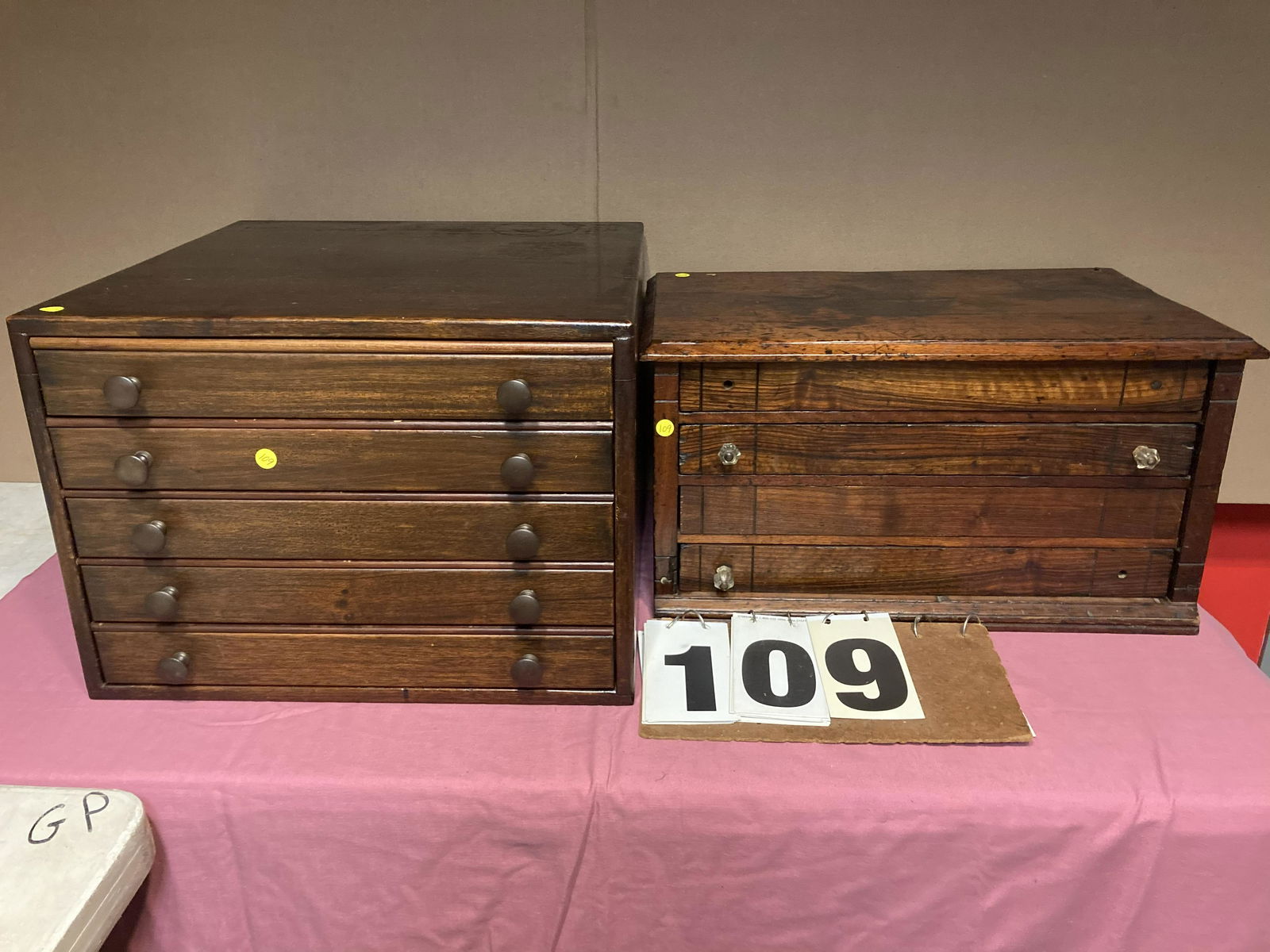 2 Multi-Drawer Spool Cabinets: (1) Walnut 1890s spool cabinet with 3 drawers. Missing 3 glass pulls. Stains on the top. Split inside and repaired. 25"l x 14.75"w x 13"h. (1) Beautiful 4 drawer 1890s walnut spool cabinet. 24.5"w x 1