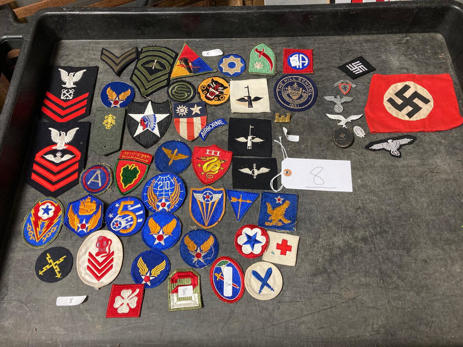 Lot of Historical American & Nazi WWII Medals & Patches: Lot of Historical American and Nazi WWII Medals and Patches. All of the historical American and Nazi WWII medals and patches found inside the German WWII helmet. 43 American patches and 1 pin. 7 Nazi 