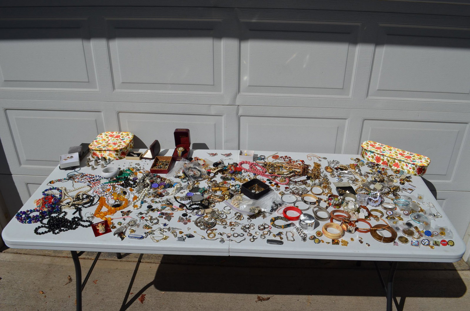 Large Lot of Costume Jewelry: Large Lot of Costume Jewelry. To include: necklaces, bracelets, rings, earrings, pins (including military pins), thimbles and watches. See photos. From the Cape Vincent, NY Estate.