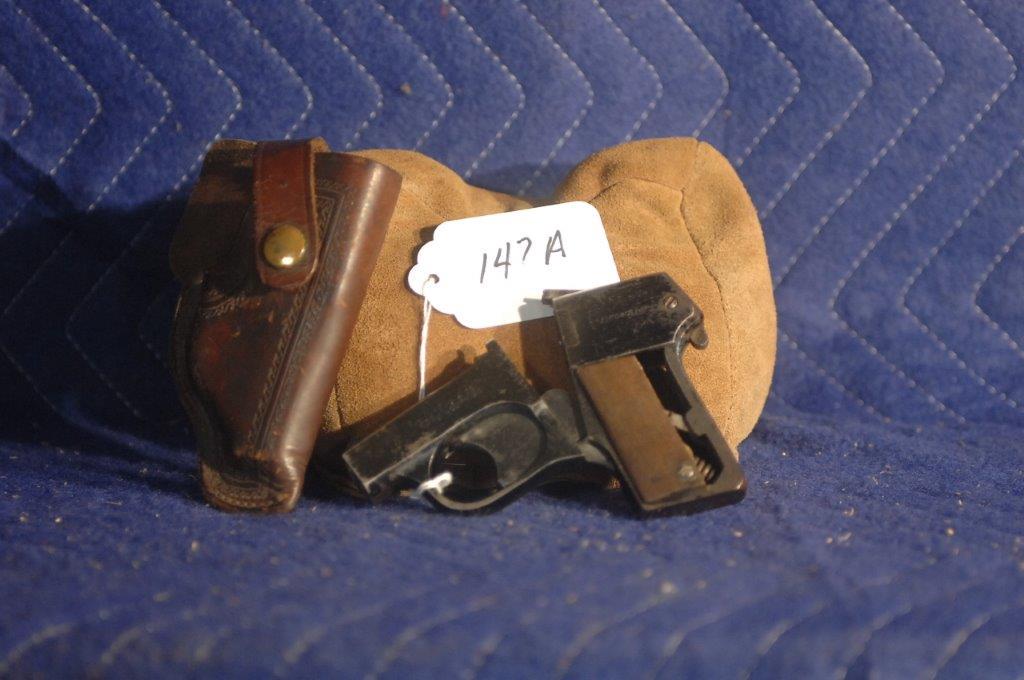 O.F. Mossberg & Sons Brownie: O.F. Mossberg & Sons Brownie .22LR. 2.5" bbl, 4 shot, damaged lock, damaged left grip panel. Comes with holster. Serial No. 27397.