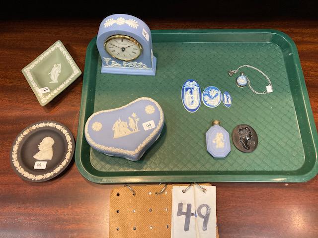 Nine Pieces of Wedgwood Blue Jasper Ware: Nine pieces of Wedgwood blue jasper ware. (1) Signed electric Boudoir clock with dancing cherubs. (1) Angel perfume. (1) Sterling pendant with nymphs and dolphin. (3) Miniature plaques. (1) Churchill