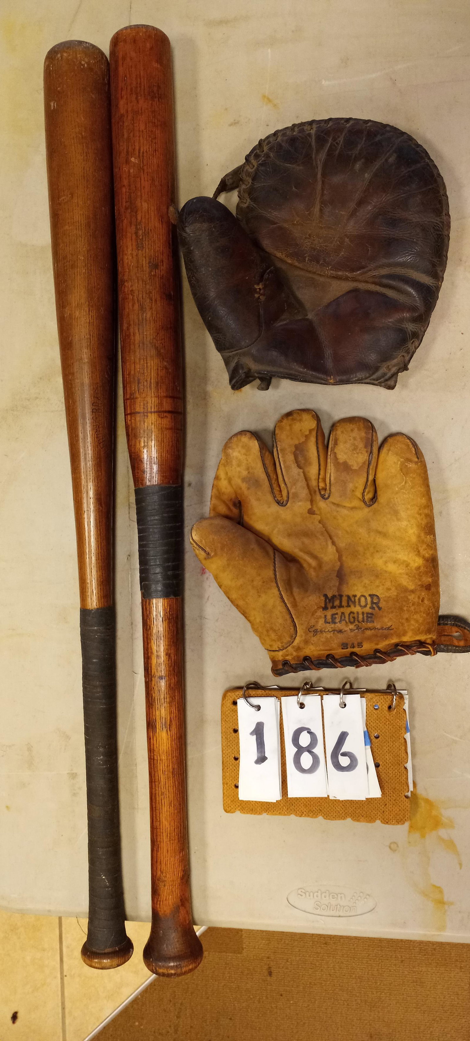 1900s Baseball Collection: 1900s baseball collection to include: (1) 33"l Hillerich & Bradsby & Co. oak bat marked League A Lewisville, KY. Owners name (W. Davis) burned into bat. Bat is cracked. (1) Homemade 32.75"l oak bat. (