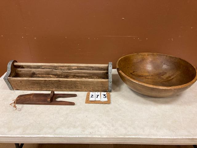 Three Miscellaneous Wooden Antique Items: Three miscellaneous wooden antique items. One 19c 21.75" dia. American wood bowl. (21.75" dia. x 6.75"h). One boot jack. (16"l x 4"w). One tool carrier (29.5"l x 9.75"w x 7.5"h). From the Jamesville, 