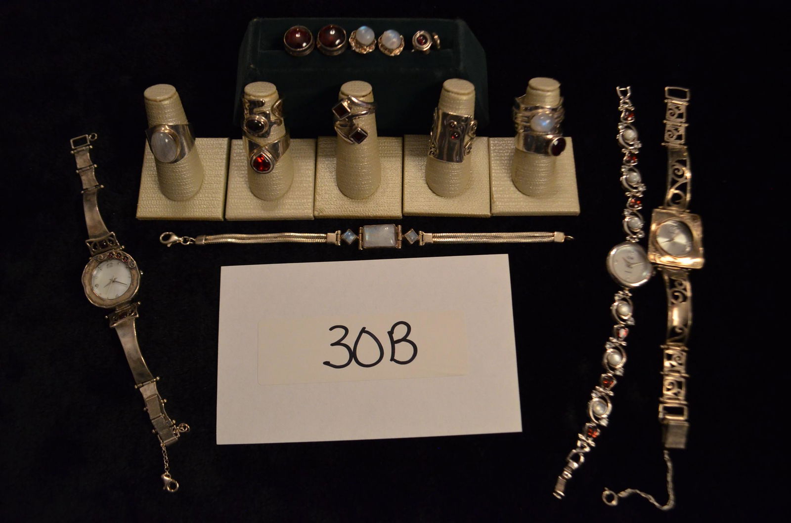 Sterling Silver and Moonstone Jewelry Collection: Sterling Silver and Moonstone Jewelry Collection. Contains 3 watches, 7 rings, 3 pairs of earrings and 1 bracelet. Moonstone and Garnet stones. Total weight is 4.97 troy oz. (including stone weight).