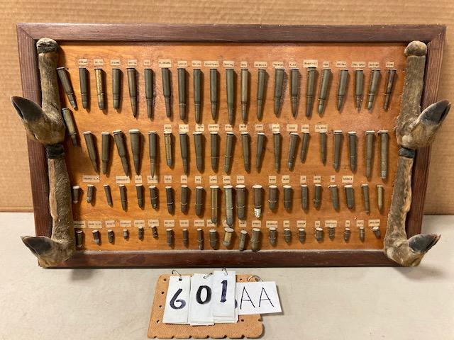 Early 1900s Bullet Board with Deer Hoof Gun Rests: Early 1900s handmade bullet board with deer hoof gun rests and 84 bullets. Out of a Blue Mountain Lake, NY camp. First time offered for sale. 26"w x 16"h. From the Rome, NY Estate.
