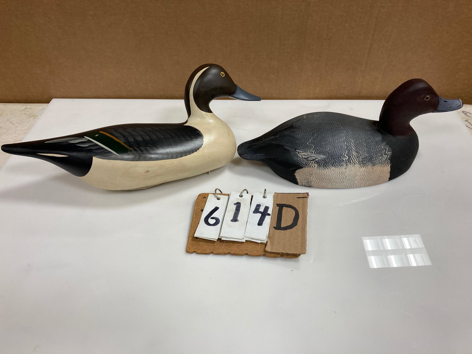 Two Hand Carved Wood Duck Decoys: Two hand carved and hand painted wood duck decoys. Includes a pintail drake carved by Harry Jobes and a beautifully done redhead drake carved by Tom Martindale with strong scratch painting. From the c