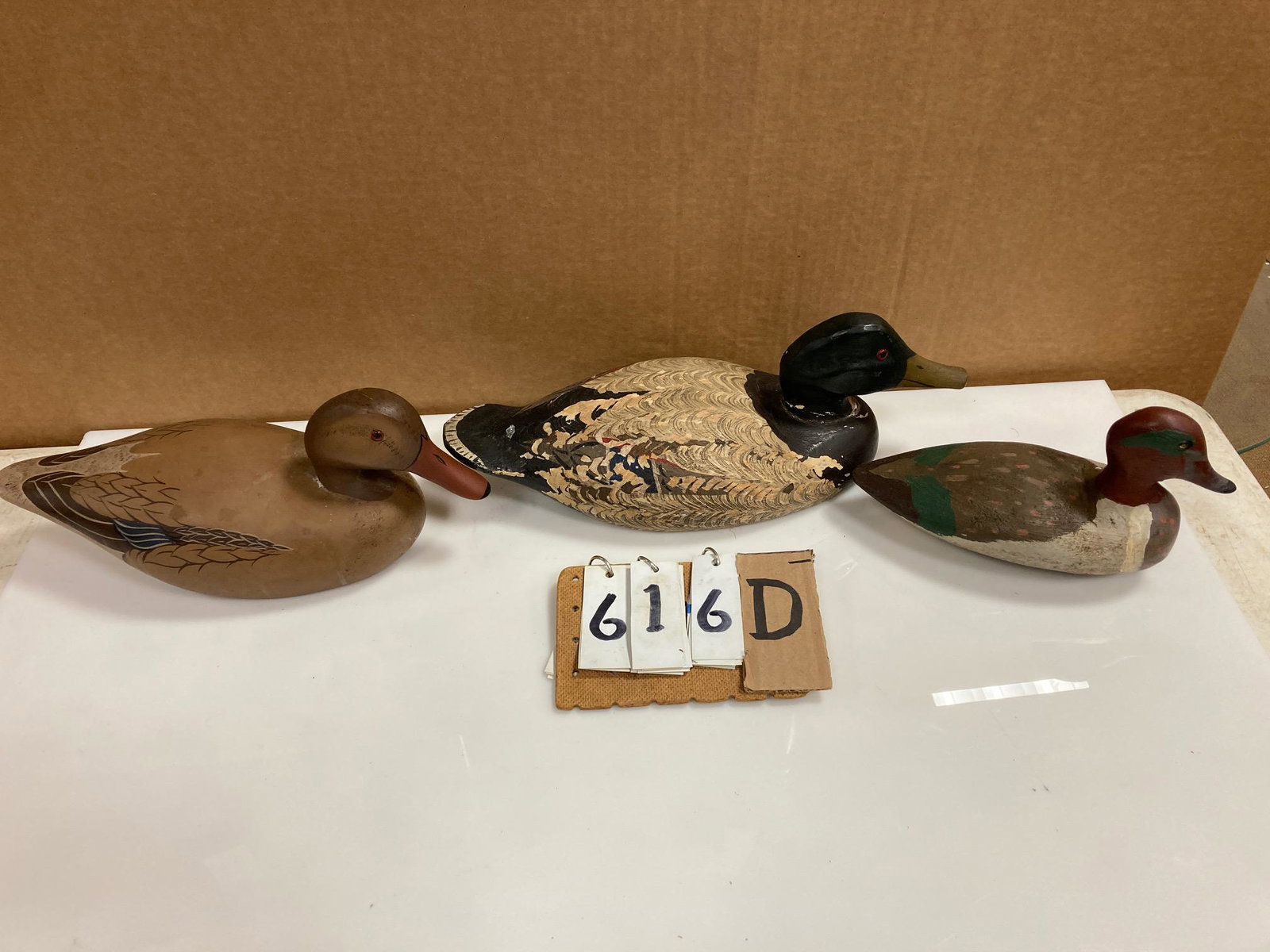 Three Hand Carved Wood Duck Decoys: Three hand carved and hand painted wood duck decoys. Includes one mallard drake, one mallard hen by Stony Point Decoys, Maryland, and one green wing teal. From the collection of one family in St. Lawr