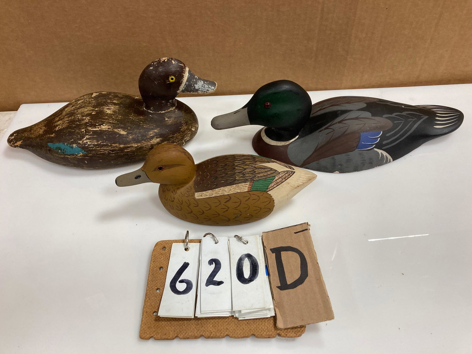 Three Hand Carved Wood Duck Decoys: Three hand carved and hand painted wood duck decoys. Includes one bluebill hen, one mallard drake and one green wing teal. From the collection of one family in St. Lawrence County, NY who loved the Ad